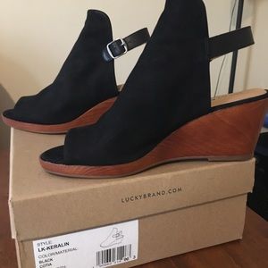 Lucky Brand Keralin black suede peep toe wedge. Brand new with box.